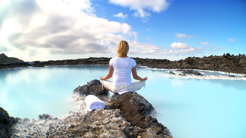 Lone female enjoying relaxing geothermal spa therapy in tranquil location