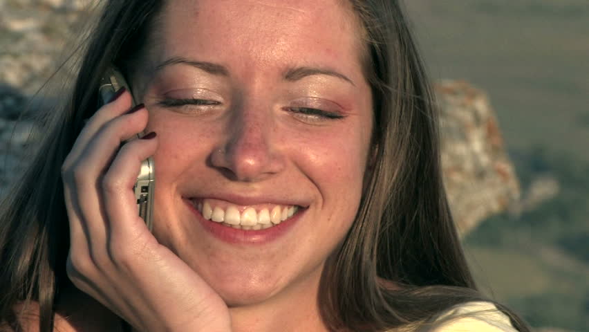 young woman speaking mobile phone on sunset HD