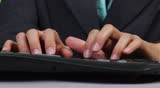 Female supervisor typing on computer - close-up - green screen