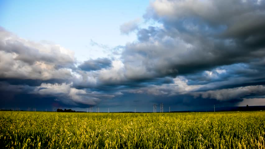hd time-lapse colorful storm sky over grain field