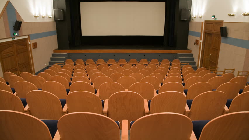 Cinema auditorium is crowding by people to watch movie performance. Ready for adding your own picture or text. Time lapse. 30 fps progressive version.