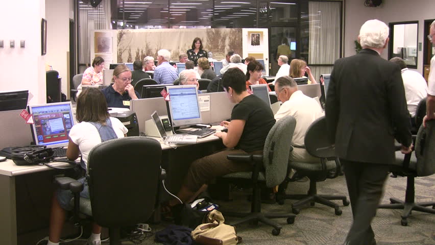 Video of a genealogy library in Salt Lake City Utah. Church of Jesus Christ of Latter-Day Saints, Mormon library. People at computers and desks doing research. Don Despain of Rekindle Photo.