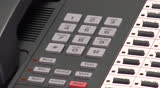 Male hand dialing various service numbers