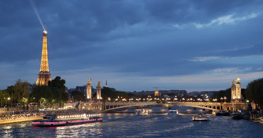 PARIS, FRANCE - JULY 25, 2013 Iconic Eiffel Tower Paris, Tourists Visit in Tour Boats on Seine River Trip French Travel Illuminated Night ( Ultra High Definition, Ultra HD, UHD, 4K, 2160P, 4096x2160 )