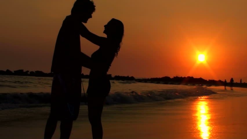 Couple kissing on beach