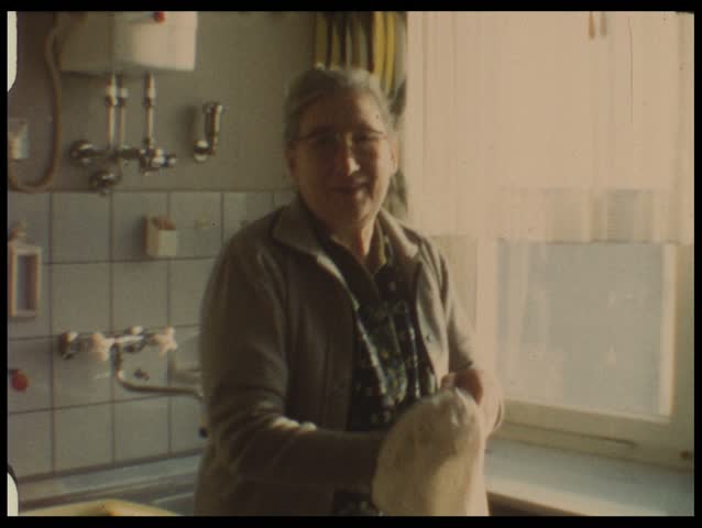 Grandma in kitchen (vintage 8 mm film)