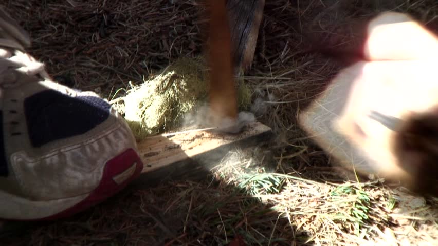 survival skills demo - making fire with a bow and drill