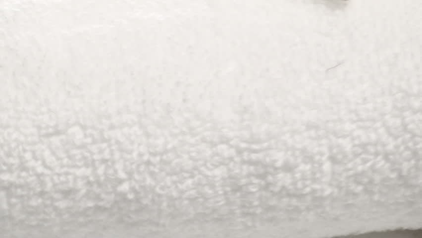 Spa towel and frangipani flower zoom-out