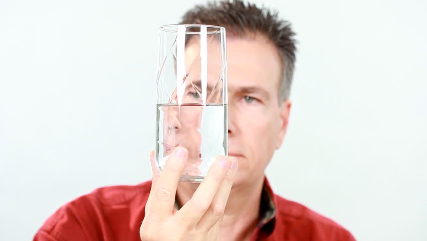 Portraying the choice one makes to see a glass that is half empty or a glass that is half full.