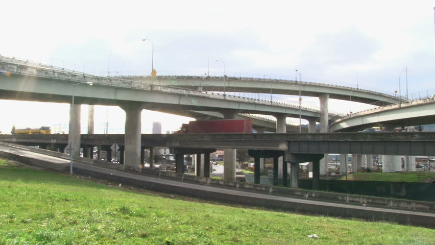 Traffic driving in Portland, Oregon over freeway overpass.