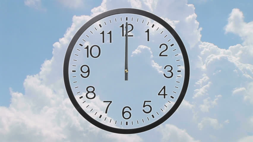 Time lapse of clock with rolling cumulus clouds - twelve hour, loopable. 