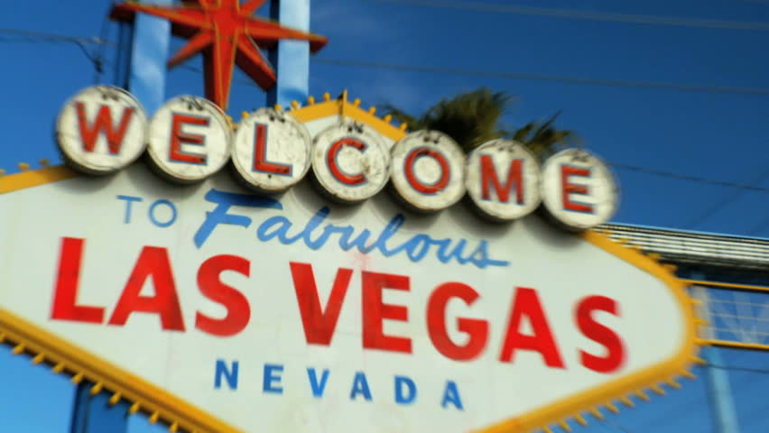 Crash zoom of famous illuminated Las Vegas welcome sign 