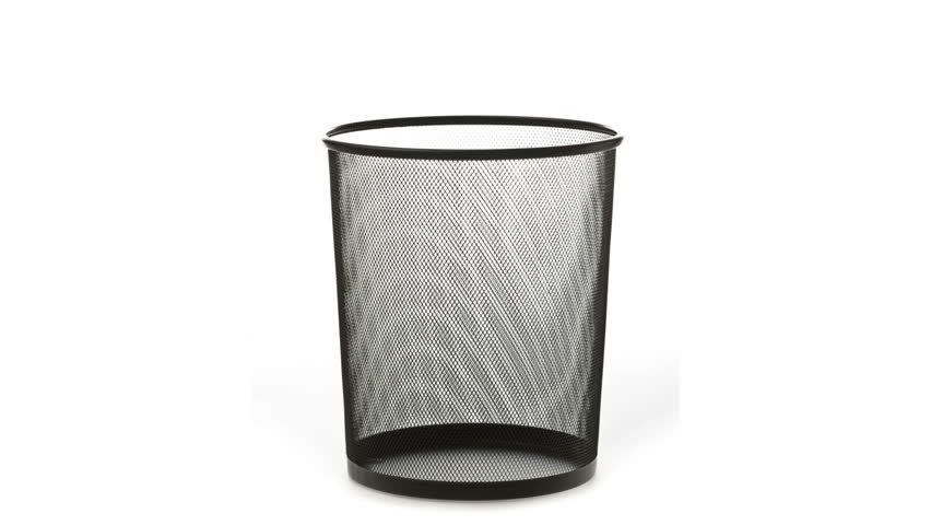 An empty office trash basket gets filled up with papers