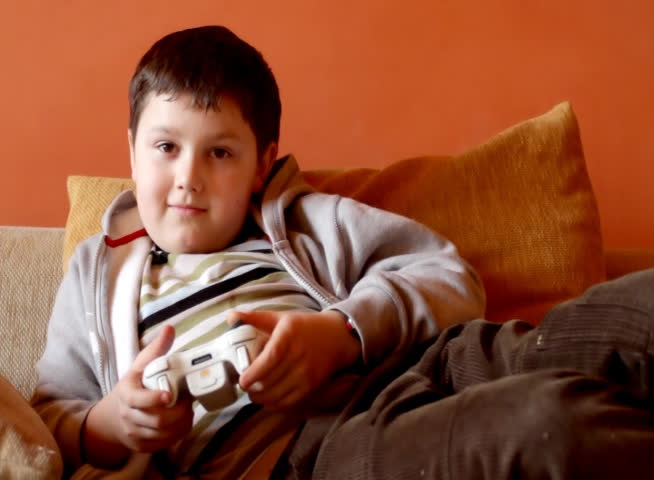 Bored boy play console games - NTSC