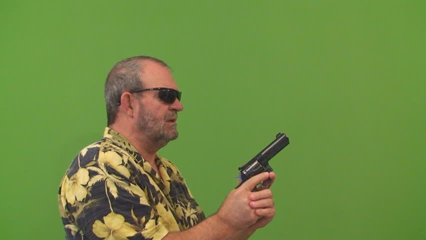 Man with a gun aiming left, right and center, Shot on a green screen