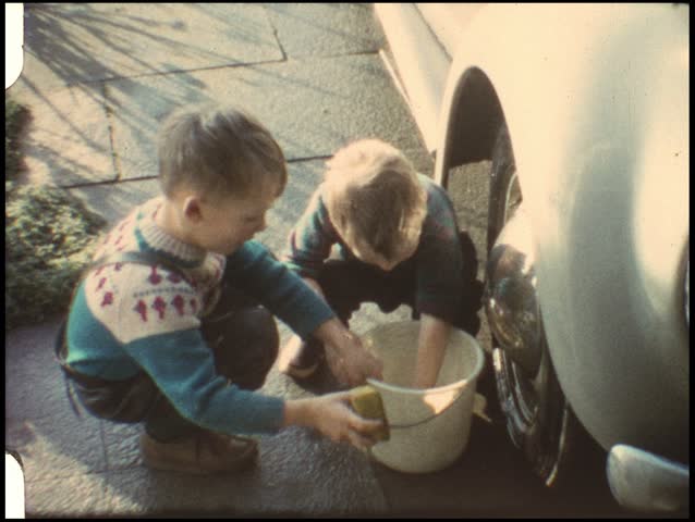 Boys washing fathers car (vintage 8 mm amateur film)