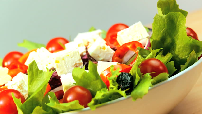 Tempting selection of fresh crisp salad vegetables & mozarella cheese making a healthy nutritious meal