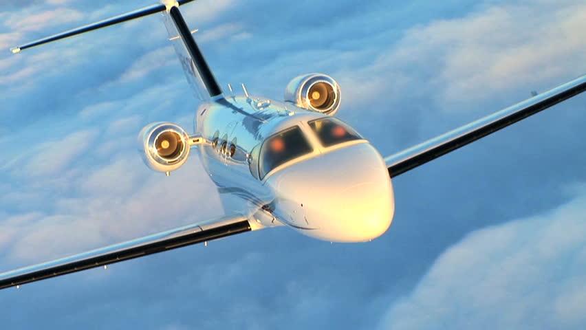 Air to air luxury corporate jet being used for modern business travel