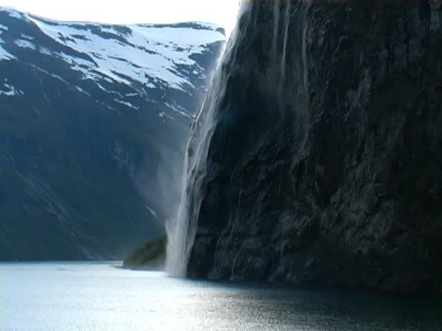 Geirangerfjord, Norway. With Seven Sisters Waterfall and snow capped mountains. Taken from a passenger cruise ship.