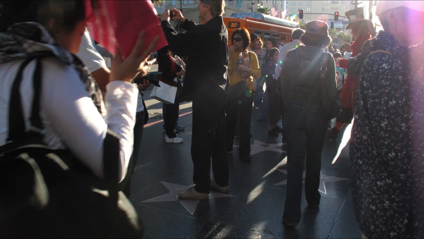 LOS ANGELES - APRIL 6: People walking by famous Walk of Fame at Hollywood Blvd. HD Time lapse. April 6, 2010 in Los Angeles, California.