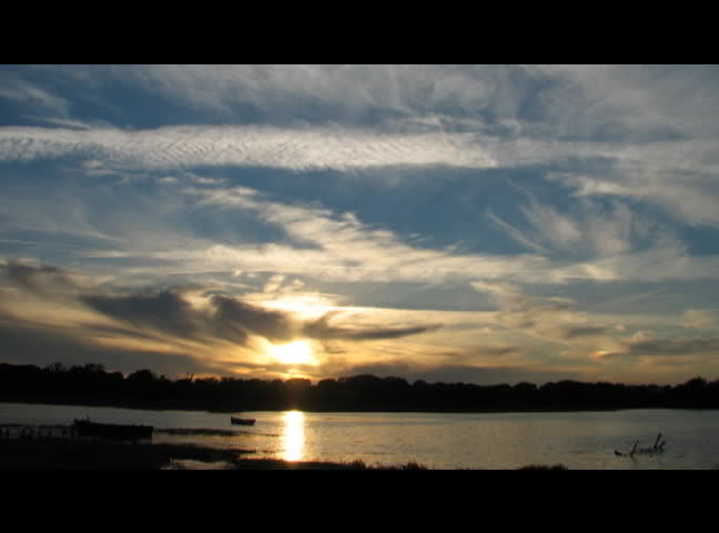 Beautiful time lapse sunset over water
