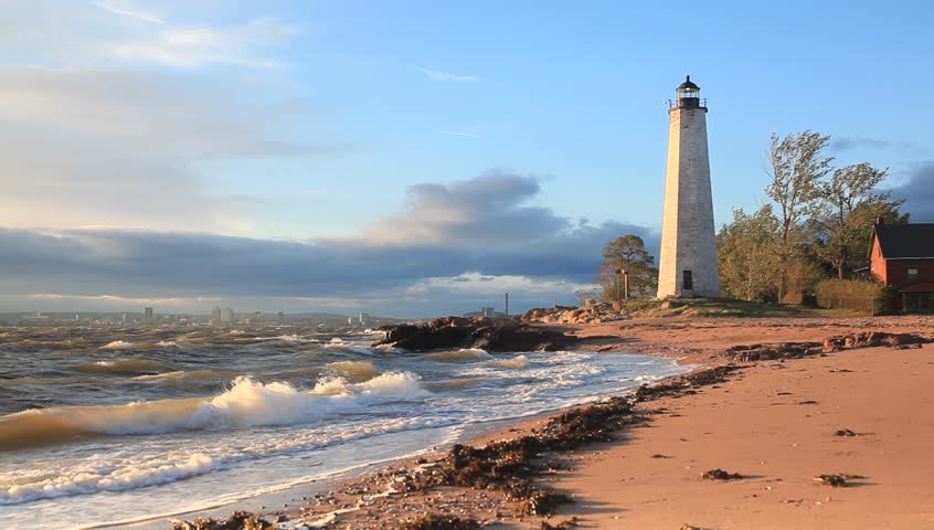 Sunset view of New Haven's Lighthouse. waves, windy day 