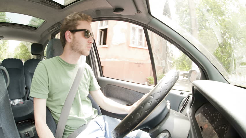 Time lapse of a young man driving car
