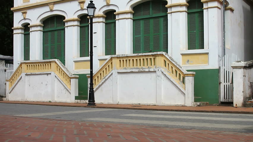 Traffic in Luang Phabang Lao  with french colonial  architecture  background