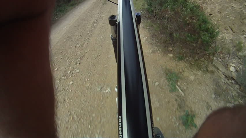 Man riding Mountain Bike along track