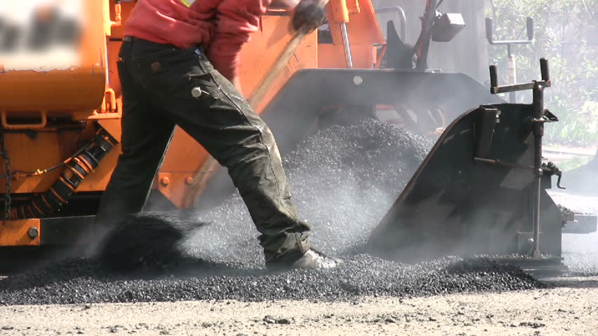 A road crew repairs the city street in Seattle, Washington.