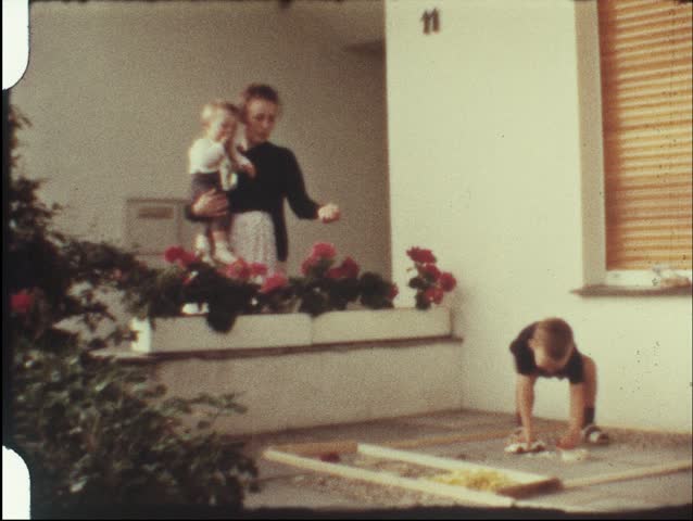 Boy playing corner store (vintage 8 mm amateur film)
