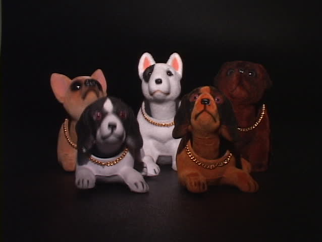 five dog bobbleheads nod in agreement, one taken away at a time, leaving none