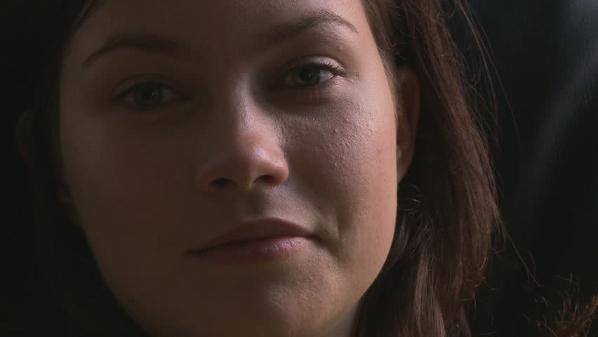 Side view portrait of young woman gazing