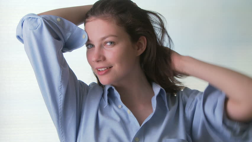 Portrait of young sensual woman wearing man's shirt