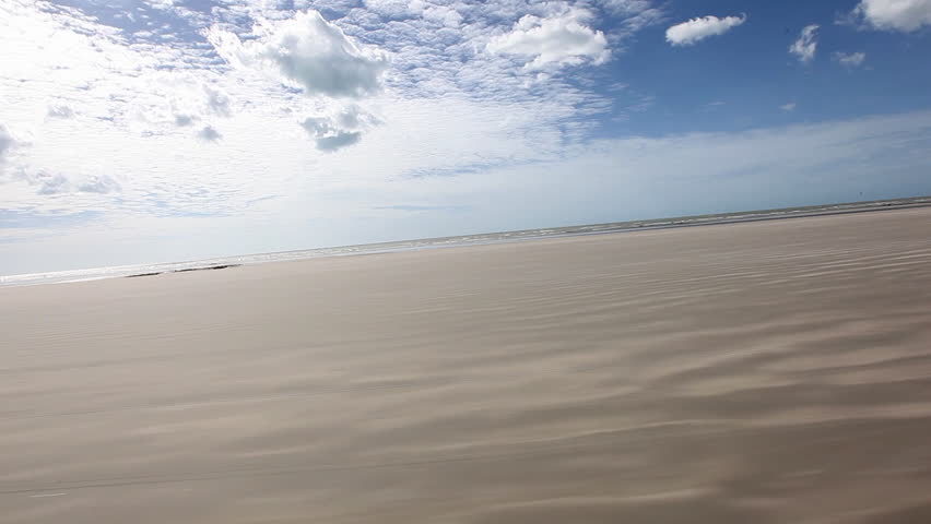 Though ride through sand dunes with a buggy, viewed from vehicle 