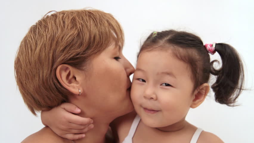 Little girls tells a gossip to her mother