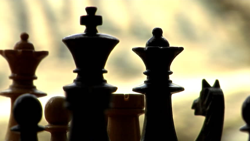Chess King Queen radial dolly track shot in the dark