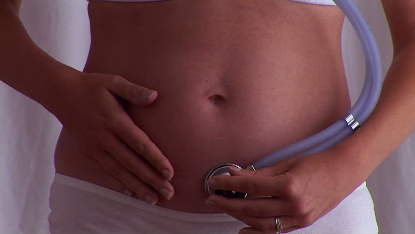 Pregnant woman posing with stethoscope 