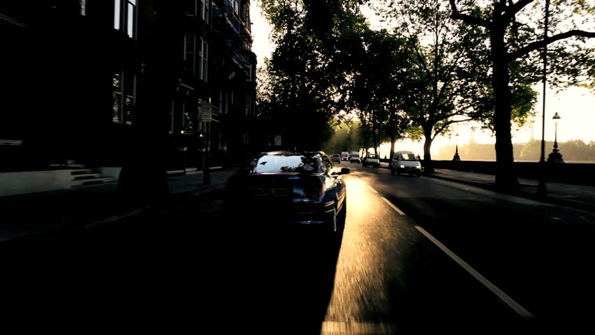 Point-of view following commuters getting to work through city streets in early morning