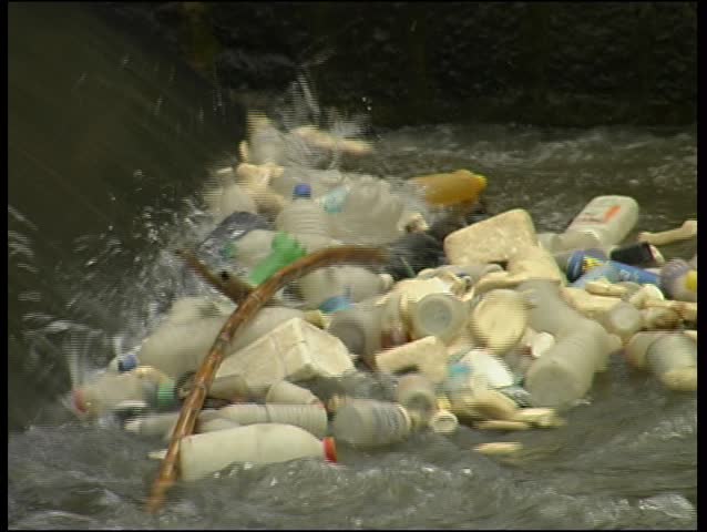 Plastic waste floating in a canal