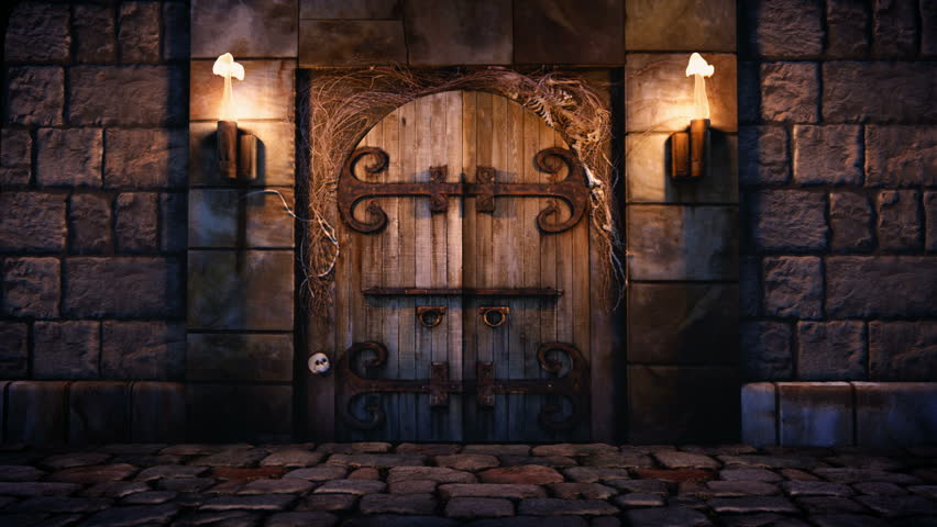 1080p Stock Video of a Spooky dungeon door flanked with two flaming torches and decorated with twigs and skeleton bones. 