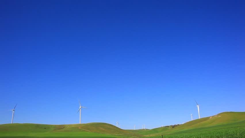Windmills under deep blue sky