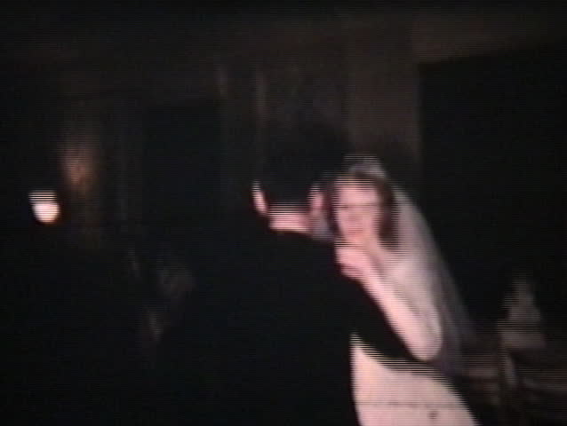 Happy attractive young newlyweds enjoy their first dance together after their wedding.