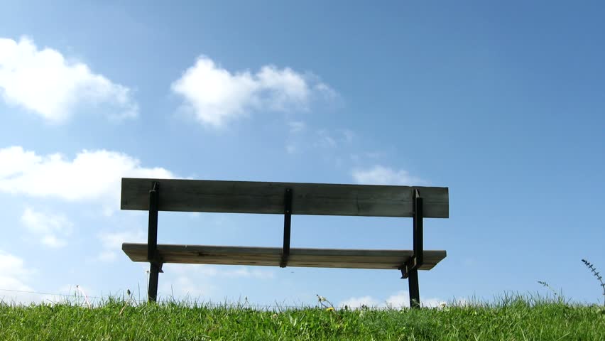 Retirement Ahead /   Bench and clouds time-lapse; concept for retirement TRACKING SHOT 