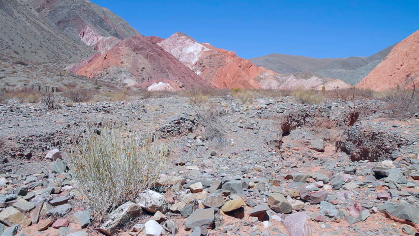 Multicolored mountains of the   Quebrada de Humahuaca valley, behind an arid landscape (Jujuy province, Argentina; 1080p, Can. 7D).