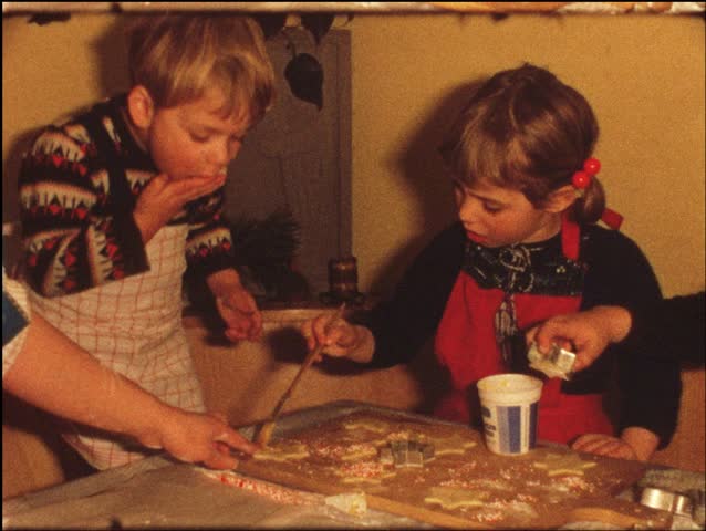 Children making Cristmas cookies (vintage 8 mm amateur film)