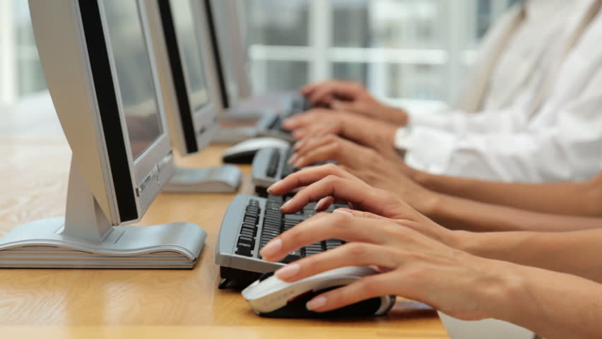 Business Team Working on Computer Terminals