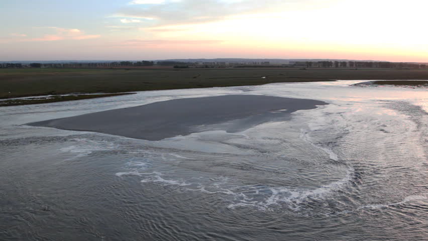 water rising tide and close sand at sunset