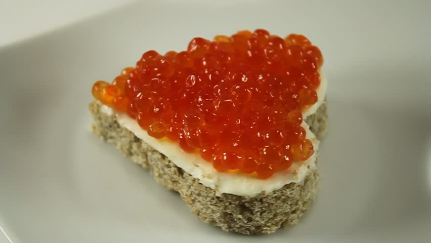 red salmon caviar on bread with butter