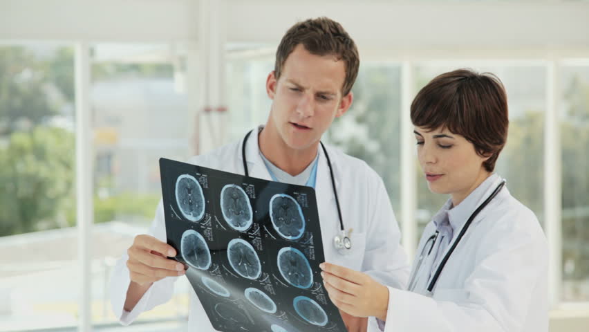 Doctors Looking Over an MRI